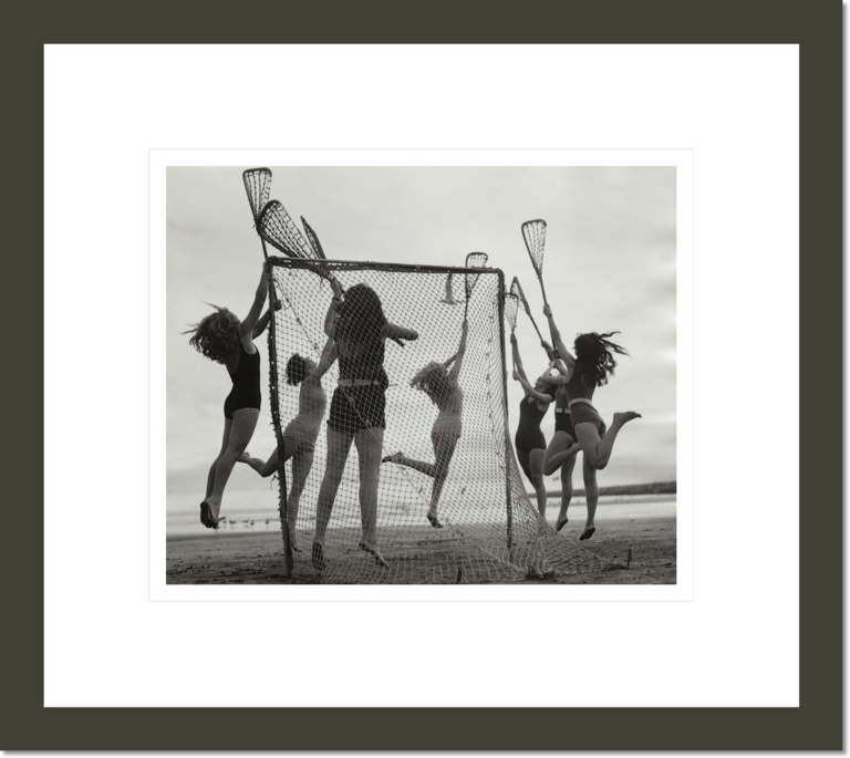 Girls Playing La Crosse on Beach