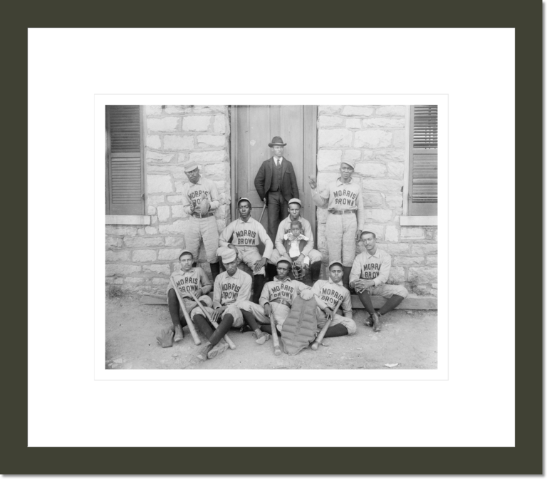 [African American baseball players from Morris Brown College, with boy and another man standing at door, Atlanta, Georgia]