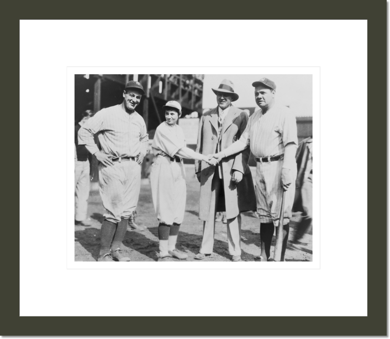 [Pitcher Jackie Mitchell shaking hands with Babe Ruth, while Lou Gehrig (left) and Joe Engel stand by]